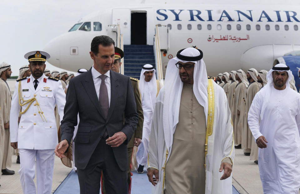 In this photo released by the Syrian Presidency, Syrian President Bashar Assad, left, speaks with UAE President Sheikh Mohammed bin Zayed Al-Nahyan, in in Abu Dhabi, United Arab Emirates, Sunday, March 19, 2023. Assad arrived in the United Arab Emirates Sunday, his first visit to the wealthy Guf country since the devastating earthquake that struck Turkey and Syria last month. (Syrian Presidency via AP)