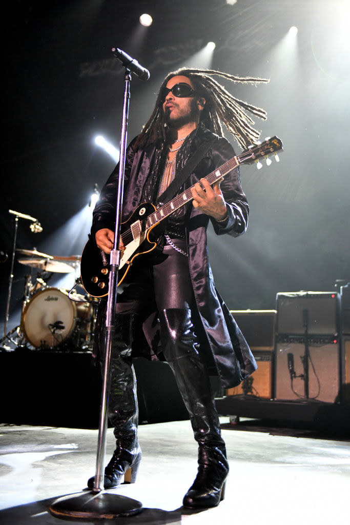 lenny playing guitar on stage