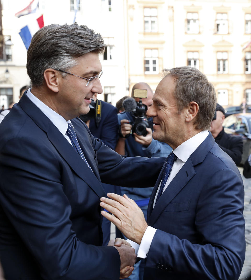 President of the European Council Donald Tusk, right, is welcomed by Croatia's prime minister Andrej Plenkovic in Zagreb, Croatia, Tuesday, Nov. 19, 2019. Donald Tusk attends the European Peoples Party (EPP) congress in Zagreb. (AP Photo/Darko Bandic)