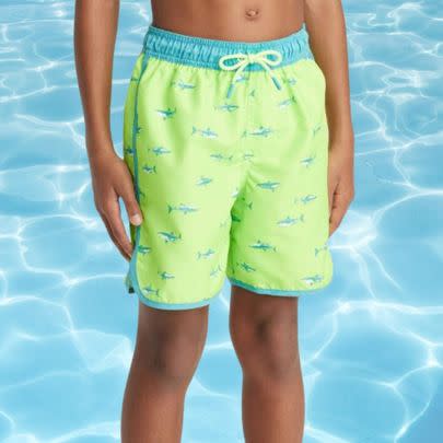 A pair of lime boy's trunks with shark design