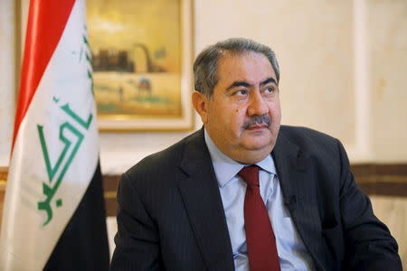 Iraq's then-Foreign Minister Hoshyar Zebari listens during an interview with Reuters in Baghdad, Iraq in this June 18, 2013 file photo. REUTERS/Thaier al-Sudani/Files