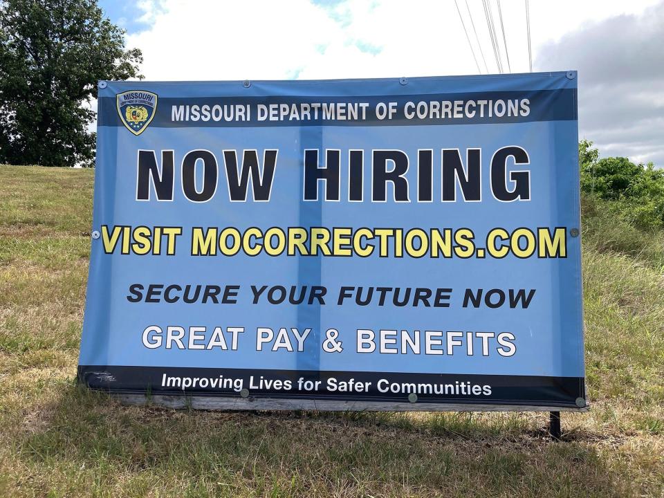 A hiring sign is displayed at the entrance to a Missouri Department of Corrections prison facility in Fulton, Missouri, in July 2023. Nearly 1 in 4 positions were vacant in late 2022 at the state’s Department of Corrections. Since raising the pay, the state has seen a rise in job applications.