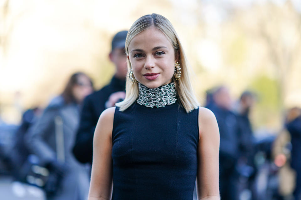 Lady Amelia Windsor wears earrings, a navy-blue sleeveless turtleneck with a bejeweled collar, outside Schiaparelli, during Paris Fashion Week - Haute Couture Spring/Summer 2020, on January 20, 2020 in Paris, France.