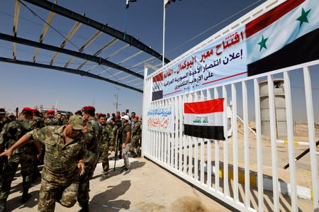 Security forces are seen at the Iraqi-Syrian border, in Al Qaim