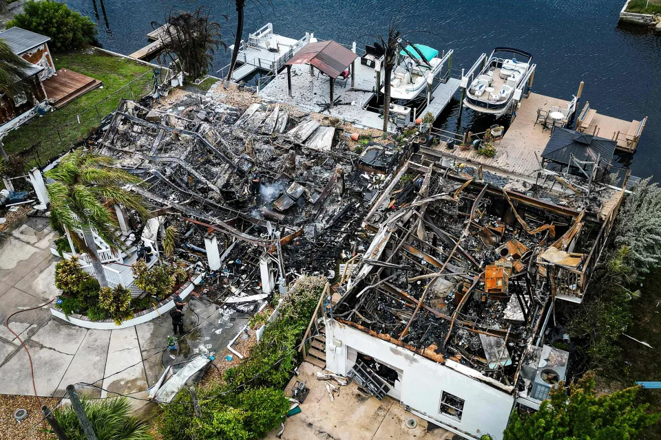 Image: Burned rubble where a house stood after a power transformer explosion in the community of Signal Cove in Hudson, Fla., on Aug. 30, 2023, after Hurricane Idalia made landfall. (Miguel J. Rodriguez Carrillo / AFP - Getty Images)