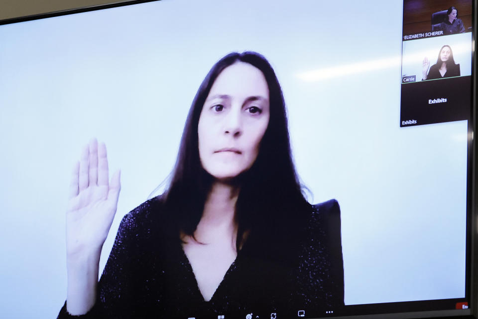 Carrie Yon is sworn in as she testifies via Zoom during the penalty phase of the trial of Marjory Stoneman Douglas High School shooter Nikolas Cruz at the Broward County Courthouse in Fort Lauderdale, Fla., Thursday, Sept. 1, 2022. Yon was Cruz's 8th grade language arts teacher during the 2013-14 school year at Westglades Middle School. Cruz previously plead guilty to all 17 counts of premeditated murder and 17 counts of attempted murder in the 2018 shootings. (Amy Beth Bennett/South Florida Sun Sentinel via AP, Pool)
