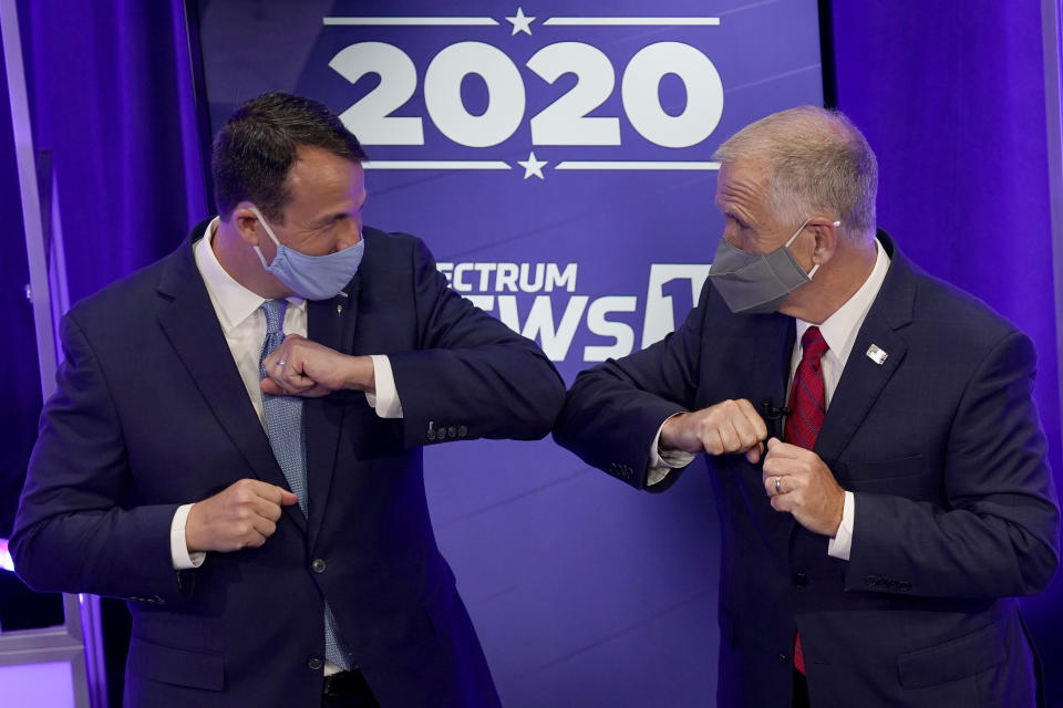 FILE - Democratic challenger Cal Cunningham, left, and U.S. Sen. Thom Tillis, R-N.C. greet each other after a televised debate Thursday, Oct. 1, 2020, in Raleigh, N.C. (AP Photo/Gerry Broome, Pool)