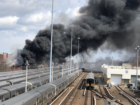 A fire breaks at a New York recycling plant next to the tracks of the Long Island Rail Road in New York City, New York, US., March 16, 2018 in this picture obtained from social media. MTA LONG ISLAND RAIL ROAD/via REUTERS