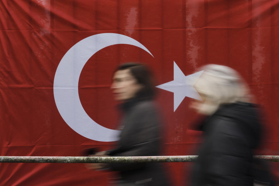 Turkish citizens living in Germany arrive at a polling station at the Turkish consulate to cast their vote for the Turkish the parliament and president election in Berlin, Germany, Thursday, April 27, 2023. Millions of Turkish citizens living abroad have began voting in national elections that will decide whether President Recep Tayyip Erdogan can govern Turkey for another term. Among the biggest contingent of overseas voters are 1.5 million Turks in Germany, who can cast their votes in presidential and parliamentary elections at 16 polling sites across the country until May 9. (AP Photo/Markus Schreiber)