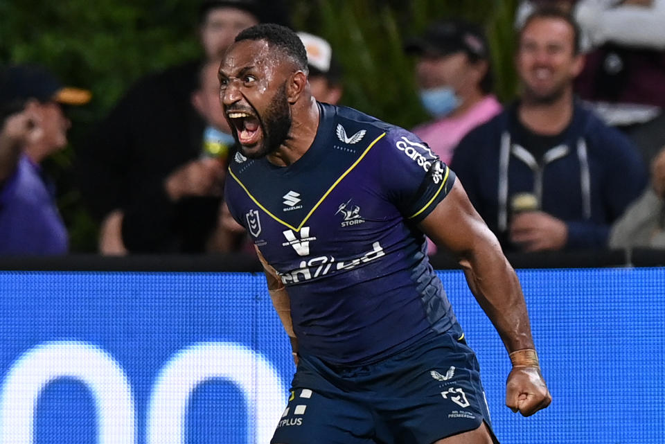 Justin Olam (pictured) celebrates after scoring a try.