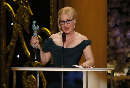 Patricia Arquette accepts the award for Outstanding Female Actor in a Supporting Role for her role in "Boyhood" at the 21st annual Screen Actors Guild Awards in Los Angeles, California January 25, 2015. REUTERS/Mario Anzuoni