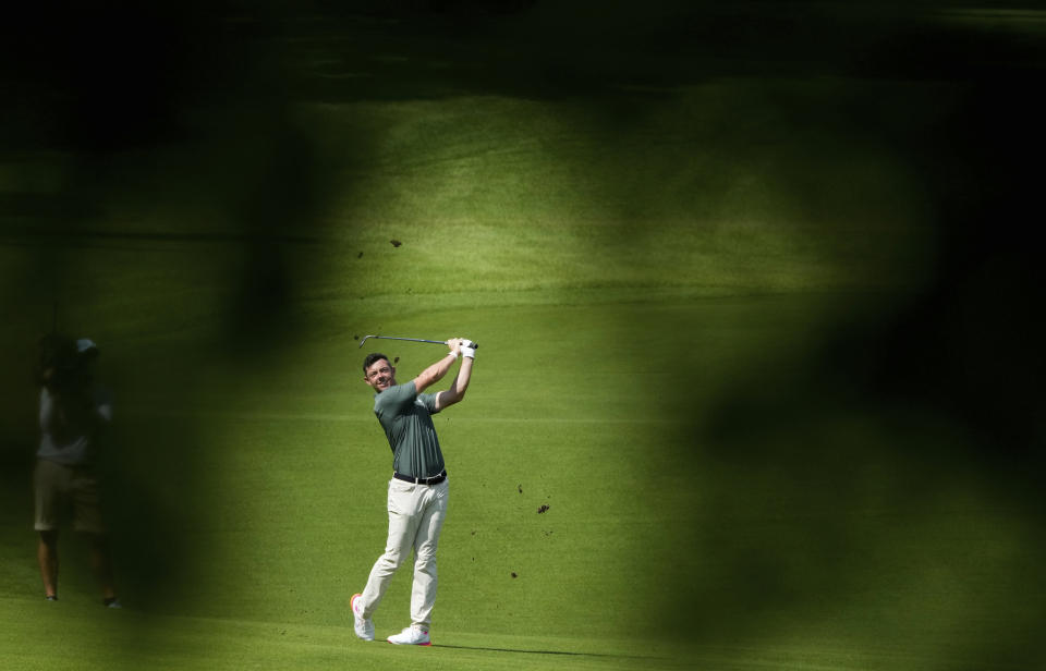 Rory McIlroy of Ireland plays a shot from the 15th fairway during the third round of the men's golf event at the 2020 Summer Olympics on Saturday, July 31, 2021, in Kawagoe, Japan. (AP Photo/Andy Wong)