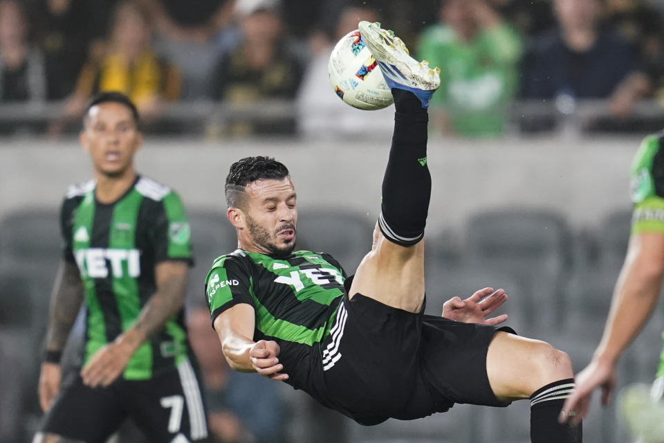 Austin FC midfielder Felipe Martins (22) kicks the ball during the second half of an MLS soccer match against the Los Angeles FC in Los Angeles, Wednesday, May 18, 2022. (AP Photo/Ashley Landis)