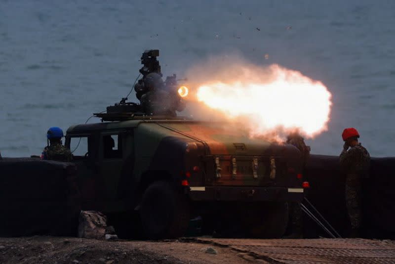 A solider launches a US-made TOW 2A missile during a live fire drill in Pingtung