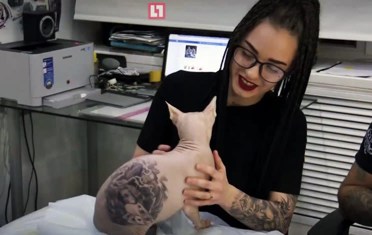 Aleksandr’s wife with Demon the tattooed cat (CEN)