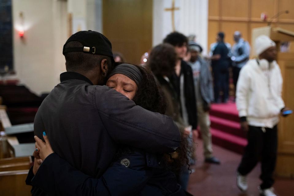 Shyra, who did not provide her last name, right, embraces a loved one after a candlelight vigil honoring the life of Michigan State University shooting victim Arielle Anderson, 19, at First English Evangelical Lutheran Church in Grosse Pointe Woods, Saturday, Feb. 18, 2023.
