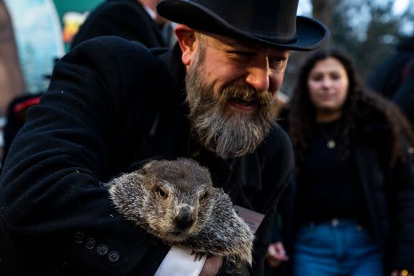 PUNXSUTAWNEY, PA - FEBRUARY 02: Groundhog handler AJ Derume holds Punxsutawney Phil, who saw his shadow, predicting a late spring during the 136th annual Groundhog Day festivities on February 2, 2023 in Punxsutawney, Pennsylvania. Groundhog Day is a popular tradition in the United States and Canada. A crowd of upwards of 5,000 people spent a night of revelry awaiting the sunrise and the groundhog's exit from his winter den. If Punxsutawney Phil sees his shadow he regards it as an omen of six more weeks of bad weather and returns to his den. Early spring arrives if he does not see his shadow, causing Phil to remain above ground.
 (Photo by Michael Swensen/Getty Images)