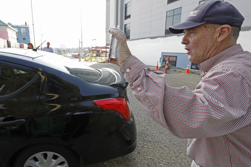 Anti abortion activist Doug Lane, calls out to a woman driving into the Jackson Women's Health Organization clinic in Jackson, Miss., Wednesday, Oct. 2, 2019. The Jackson City Council voted 3-1 Tuesday to enact a local law limiting amplified sound outside health care facilities and creating buffer zones to move protesters further from the entrances. The law is set to take effect in about a month, and opponents say it unconstitutionally limits their right to free speech. A court challenge is likely. (AP Photo/Rogelio V. Solis)