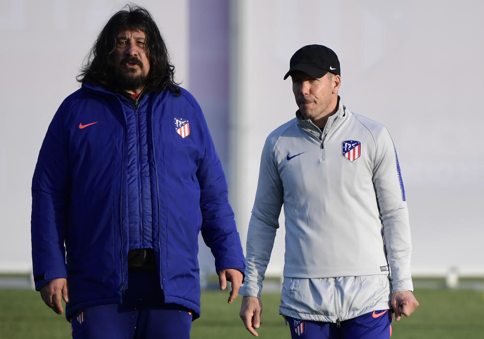 Atletico Madrid's Argentinian coach Diego Simeone (R) and Argentinian assistant coach German Burgos (L) attend a training session at the club's training ground in Madrid on February 19, 2019 ahead of the UEFA Champions League round of 16 first leg football match between Atletico Madrid and Juventus. (Photo by JAVIER SORIANO / AFP)        (Photo credit should read JAVIER SORIANO/AFP via Getty Images)