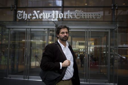 Australian freelance photojournalist Daniel Berehulak poses for a portrait outside The New York Times in Midtown, New York April 20, 2015. REUTERS/Adrees Latif