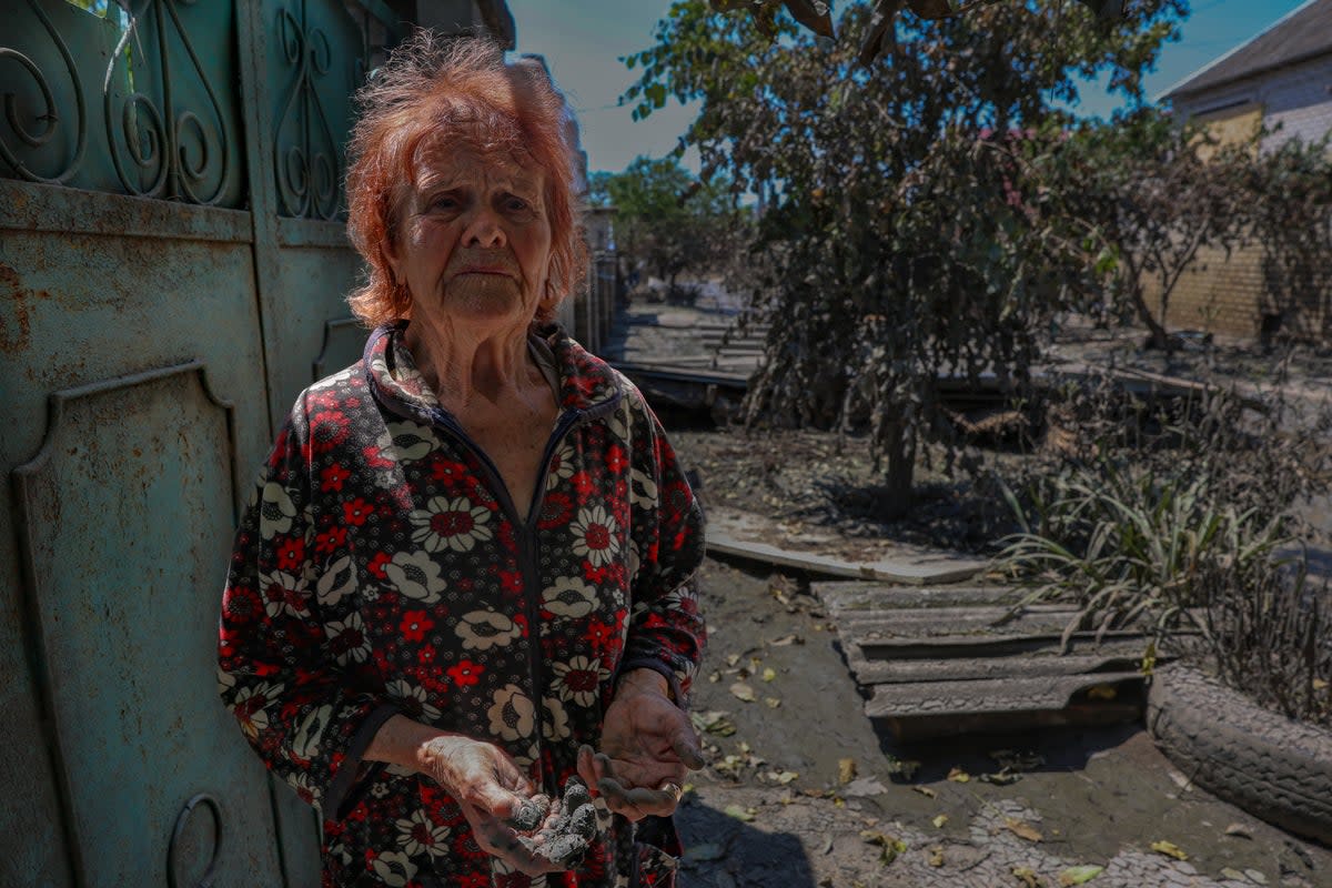 Antonia, 84, in a nightie that is the only possession she has left in the world after the waters of the Kakhovka dam destroyed her home (Bel Trew)