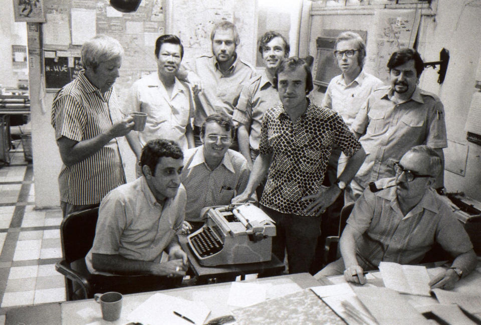 FILE - In this April 18, 1972, file photo, front row from left, George Esper, Carl Robinson, Peter Arnett and Ed White and back row, from left, Hugh Mulligan, chief Vietnamese reporter Huynh Minh Trinh, Holger Jensen, Richard Blystone, Max Nash and Richard Pyle pose in the AP Saigon bureau. Nash, who covered the conflicts in Southeast Asia and the Middle East and helped nurture a new generation of female photojournalists during more than 40 years with The Associated Press, died Friday, Sept. 28, 2018, after collapsing at home. He was 77. (AP Photo/File)