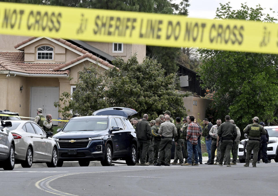 Riverside County Sheriff's stand at the corner of Golden West Ave and Condor Drive in Jurupa Valley, Calif. Thursday, Dec. 29, 2022. Authorities say a Southern California sheriff’s deputy has been shot during a traffic stop. (Will Lester/The Orange County Register via AP)