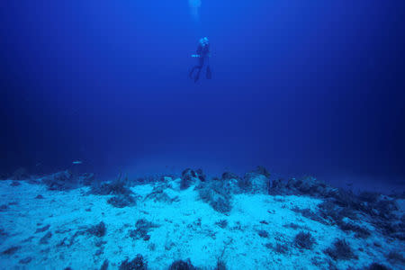 Chief conservator of the Fournoi Survey Project Angelos Tsompanidis, 42, swims over a shipwreck site on the island of Fournoi, Greece, September 19, 2018. Picture taken September 19, 2018. Vassilis Mentogiannis/Hellenic Ephorate of Underwater Antiquities/Handout via REUTERS ATTENTION EDITORS - THIS PICTURE WAS PROVIDED BY A THIRD PARTY.