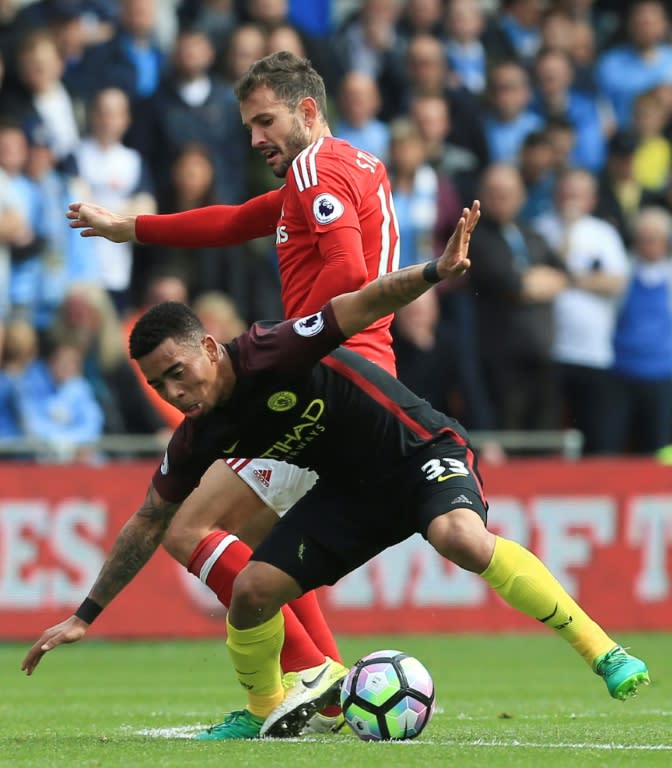 Manchester City's striker Gabriel Jesus (L) clashes with Middlesbrough's striker Christian Stuani on April 30, 2017