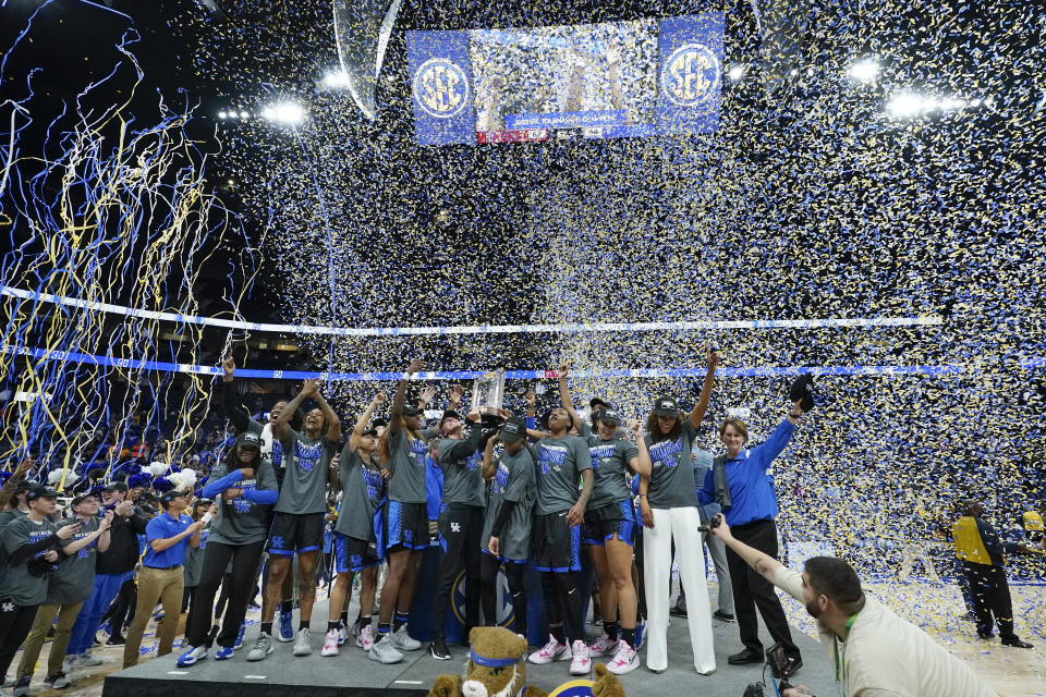 Kentucky players and coaches celebrate after beating South Carolina to win the NCAA women's college basketball Southeastern Conference tournament championship game Sunday, March 6, 2022, in Nashville, Tenn. (AP Photo/Mark Humphrey)