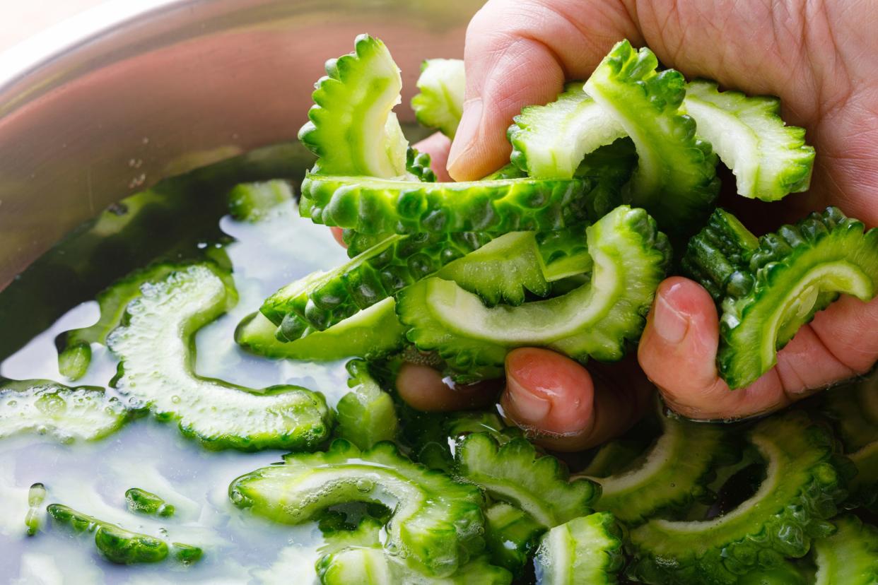 Cut bitter gourd, fry it with tofu and pork, and finally add beaten egg.