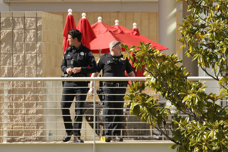 Police officers and crime scene markers are seen at YouTube headquarters. REUTERS/Elijah Nouvelage