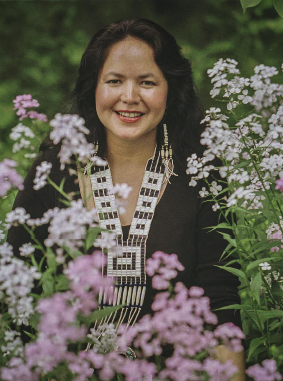 FILE - Native American singer Joanne Shenandoah poses at the ancient Oneida Indian village site known as Nichols Pond near Canastota, N.Y., on June 12, 1996. Shenandoah, the celebrated Native American singer-songwriter who performed before world leaders and on high-profile stages, has died. The Native American Music Awards & Association posted on its website that Shenandoah, described as “Native America's musical matriarch," died Monday night, Nov. 22, 2021, in Scottsdale, Ariz., after complications of abdominal bleeding. She was 63. (AP Photo/Michael Okoniewski, File)