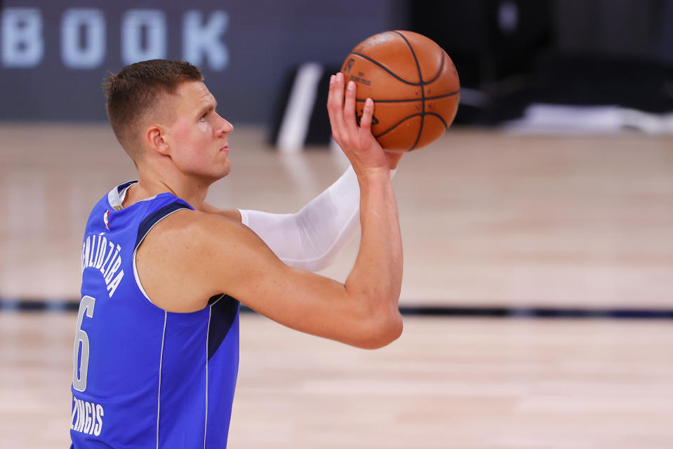 Kristaps Porzingis will be out until &quot;at least January,&quot; according to the Dallas Mavericks. (Mike Ehrmann/Getty Images)