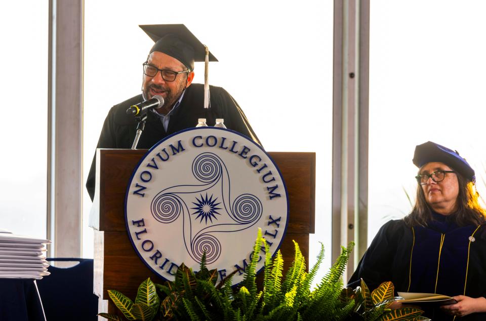 Mark Famiglio, a New College of Florida alum and longtime local businessman and philanthropist, speaks during the school's May 17, 2024, graduation ceremony on the grounds of College Hall.