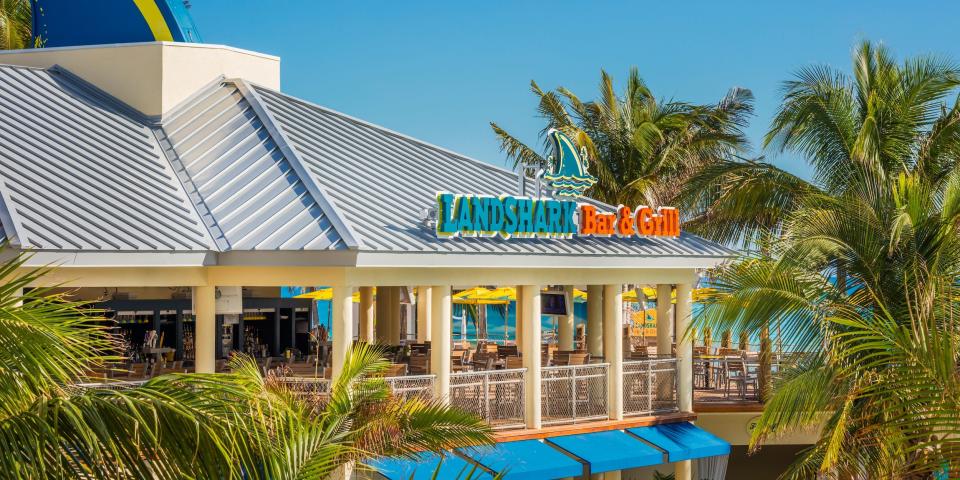 A Landshark Bar and Grill location among palm trees and blue skies