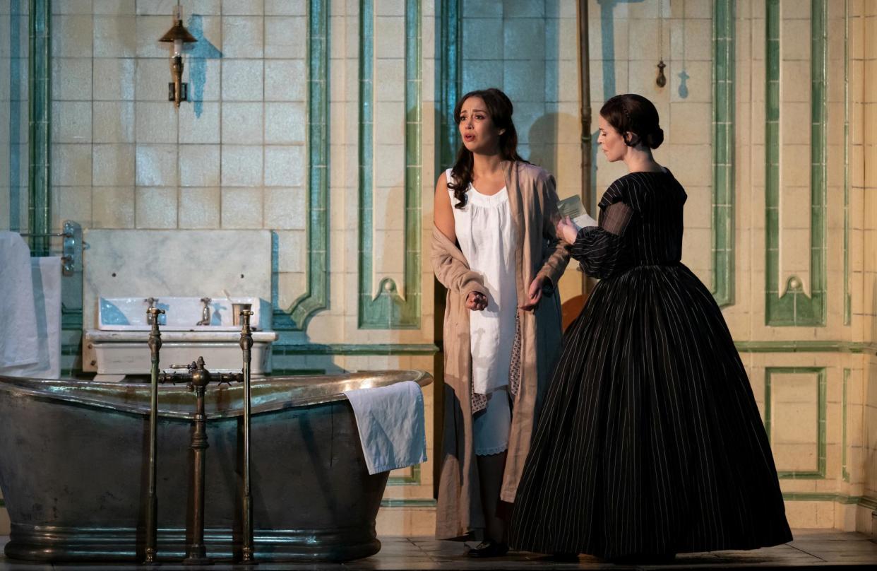 <span>‘Gold-silver high notes’: American soprano Nadine Sierra, centre, in the title role of Lucia di Lammermoor, with Rachael Lloyd as Alisa.</span><span>Photograph: Camilla Greenwell</span>