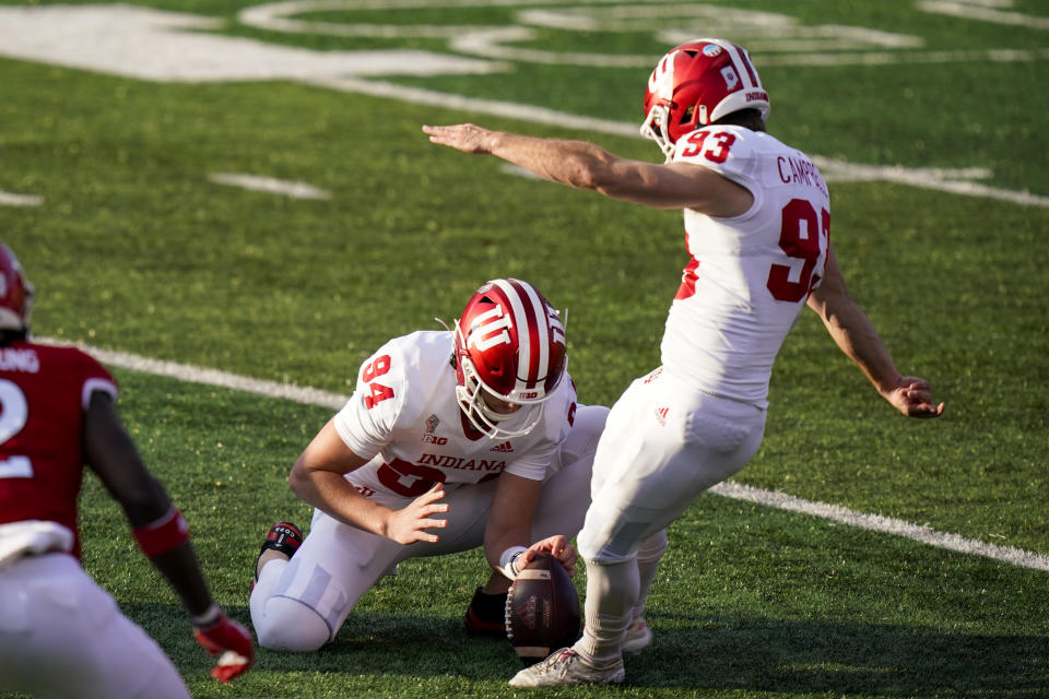 Indiana's Haydon Whitehead (94) holds the ball as Charles Campbell (93) kicks a field goal during the second quarter of the team's NCAA college football game against Rutgers, Saturday, Oct. 31, 2020, in Piscataway, N.J. (AP Photo/Corey Sipkin)