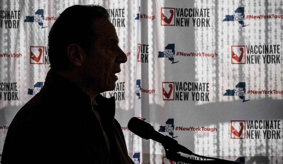 FILE - In this Saturday, Jan. 23, 2021, file photo, Gov. Andrew Cuomo speaks to reporters during a news conference at a COVID-19 pop-up vaccination site in the Brooklyn borough of New York. The Justice Department says it's decided against opening up any civil rights investigations against government-run nursing homes in New York over their COVID-19 response, in a letter to members of U.S. Congress, Friday, July 23, 2021. (AP Photo/Mary Altaffer, Pool, File)