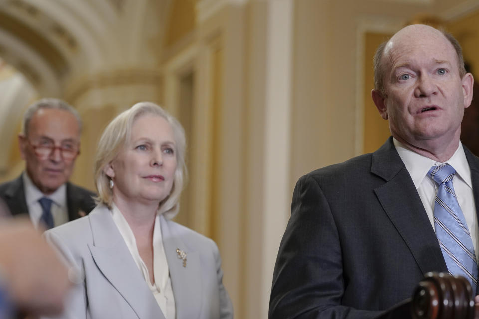 Sen. Chris Coons, D-Del., right, speaks as Senate Majority Leader Chuck Schumer, of D-N.Y., left and Sen. Kirsten Gillibrand, D-N.Y., listen during a news conference after a policy luncheon, Wednesday, June 7, 2023, on Capitol Hill in Washington. (AP Photo/Mariam Zuhaib)