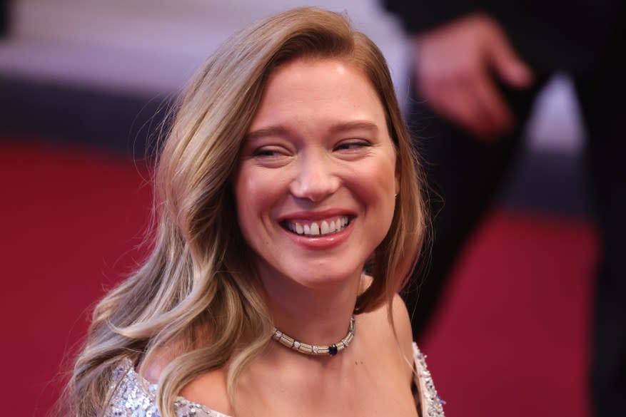 Léa Seydoux smiling at the camera on the red carpet at the 77th annual Cannes Film Festival for 'The Second Act' screening.