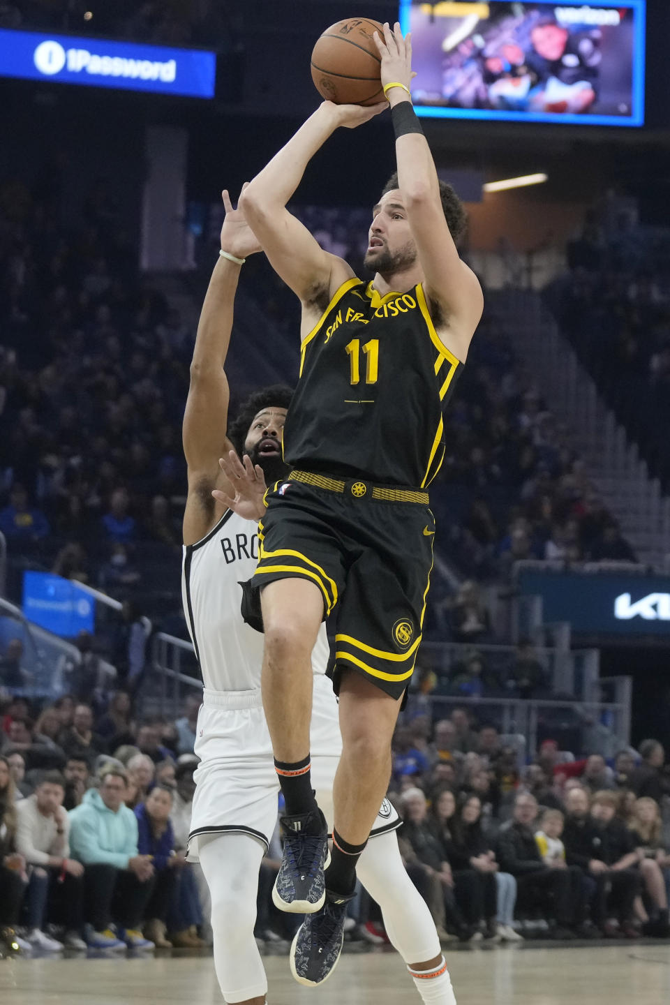 Golden State Warriors guard Klay Thompson (11) shoots against Brooklyn Nets guard Spencer Dinwiddie during the first half of an NBA basketball game in San Francisco, Saturday, Dec. 16, 2023. (AP Photo/Jeff Chiu)