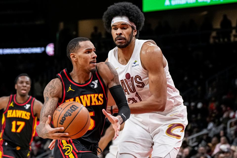 Atlanta Hawks guard Dejounte Murray (5) is defended by Cleveland Cavaliers center Jarrett Allen (31) on Jan. 20 in Atlanta.