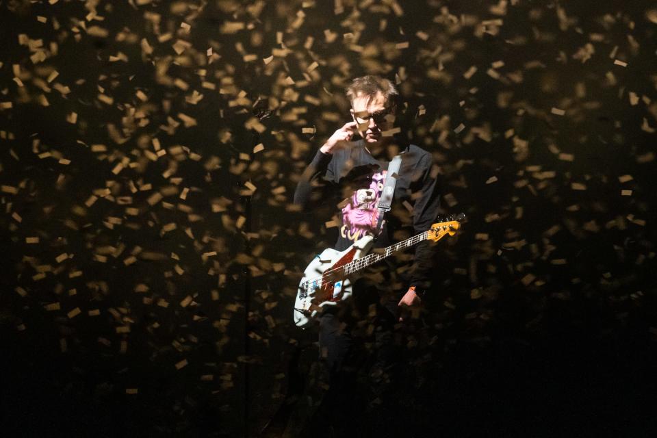 Members of Blink-182 perform on stage as confetti fills the air at the Footprint Center in Phoenix on Wednesday, June 14, 2023.