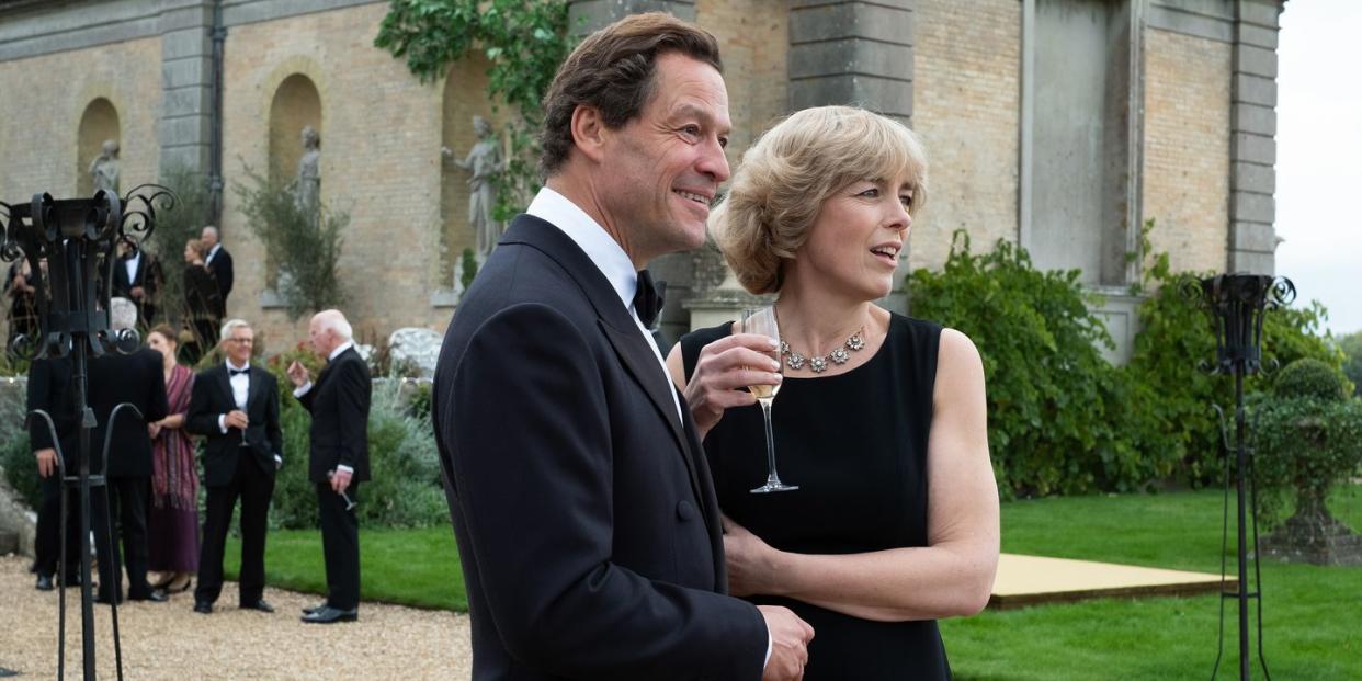 a man and woman holding wine glasses