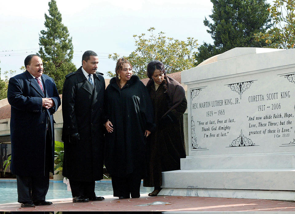 FILE-- In this file photo taken Nov. 20, 2006 the children of the Rev. Martin Luther King Jr. and Coretta Scott King from left, Martin Luther King III, Dexter King, the late Yolanda King and Bernice King stand next to a new crypt dedicated to their parents in Atlanta. Bernice is in a legal battle with her brothers over their father's Bible and Nobel Peace Prize medal. (AP Photo/W.A. Harewood, File)
