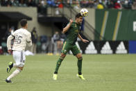 Portland Timbers defender Josecarlos Van Rankin heads the ball against Los Angeles FC during an MLS soccer match Sunday, Sept. 19, 2021, in Portland, Ore. (Sean Meagher/The Oregonian via AP)