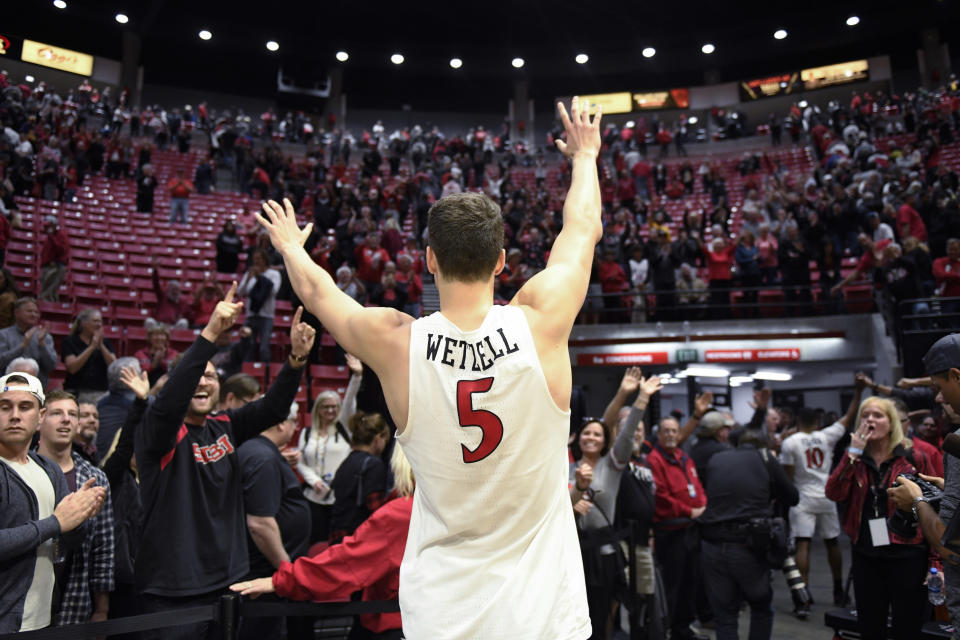 San Diego State forward Yanni Wetzell (5) waves to the crowd after the team's NCAA college basketball game against Colorado State on Tuesday, Feb. 25, 2020, in San Diego. San Diego State won 66-60. (AP Photo/Denis Poroy)