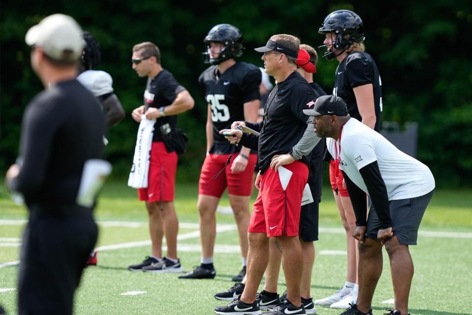 UC head coach Scott Satterfield surveys the Bearcats during a mid-August practice at Camp Higher Ground in West Harrison, Indiana.