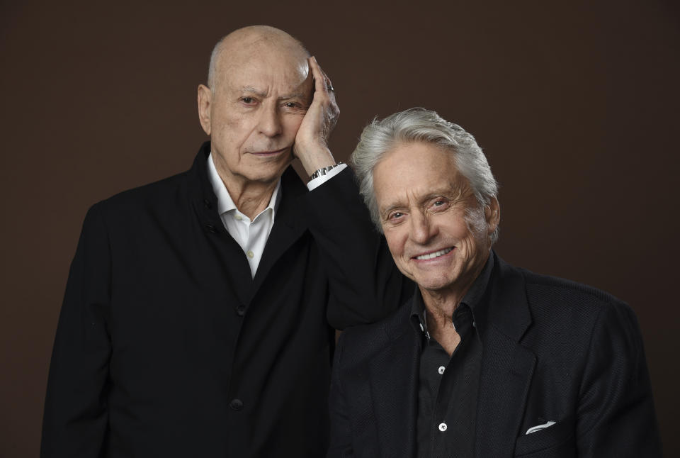 In this Nov. 7, 2018 photo, Alan Arkin, left, and Michael Douglas, cast members in the Netflix comedy series "The Kominsky Method," pose for a portrait at the Beverly Wilshire Four Seasons hotel in Beverly Hills, Calif. The pair play Hollywood veterans facing the indignities of aging in a change-of-pace comedy-drama from sitcom hitmaker Chuck Lorre. (Photo by Chris Pizzello/Invision/AP)